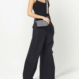 Grey bag worn by a person, showing the bag's fit