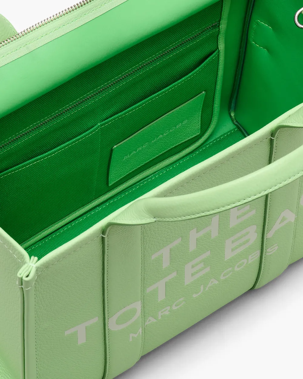 Close up of green bags,showing texture of the leather fabric.