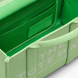 Close up of green bags,showing texture of the leather fabric.