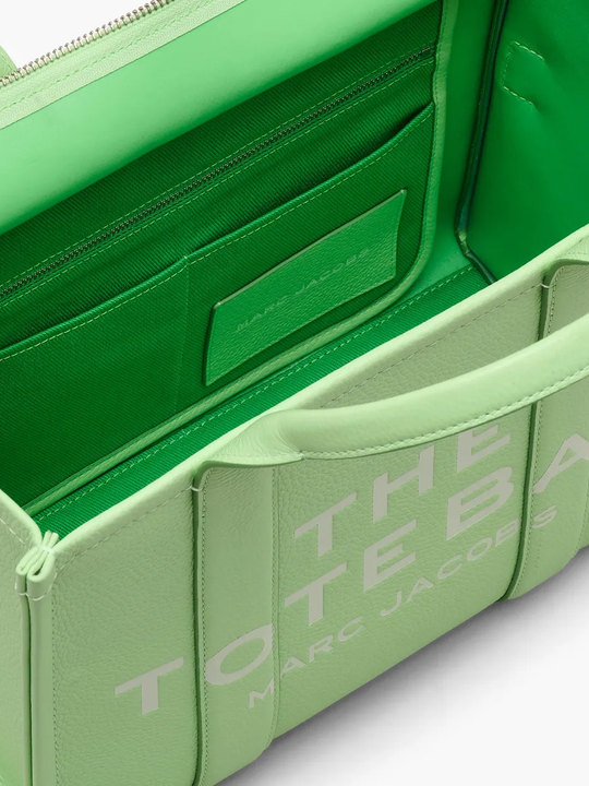 Close up of green bags,showing texture of the leather fabric.