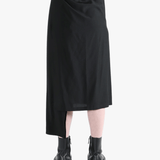 Black skirt worn by a person, showing the skirt fit