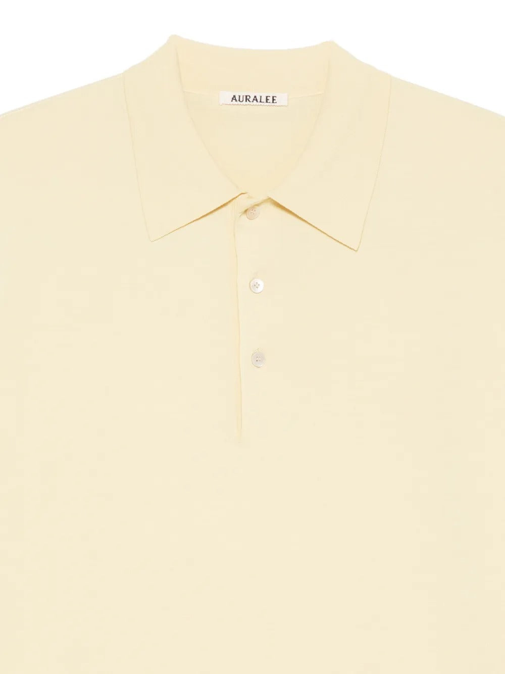 Close up of yellow T-shirts, showing texture of the cotton fabric