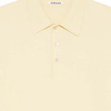 Close up of yellow T-shirts, showing texture of the cotton fabric