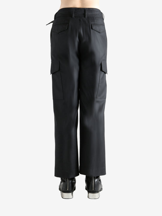 Black pant worn by a person, showing the pant's fit