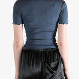 Blue t-shirt worn by a person, showing the shirt's fit