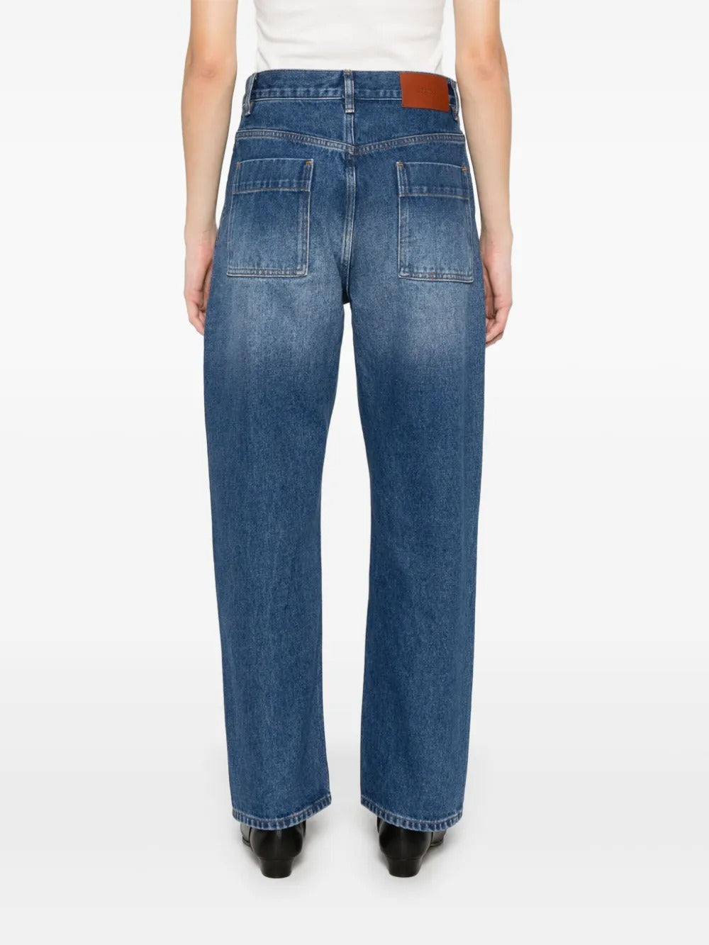 Blue jeans worn by a person, showing the jeans' fit