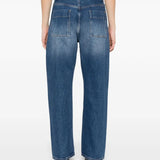 Blue jeans worn by a person, showing the jeans' fit