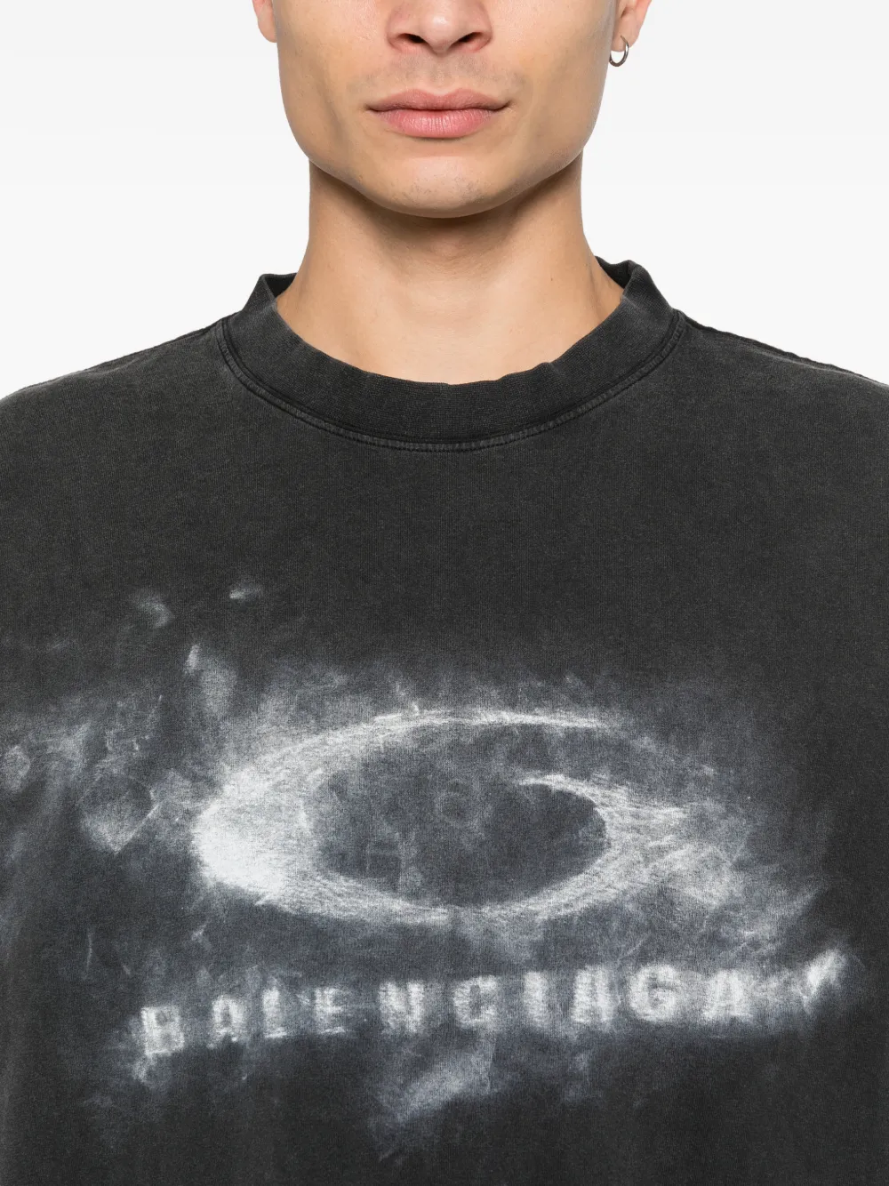 Close up of black t-shirt, showing texture of the Cotton fabric