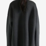 Grey jacket worn by a person, showing the jacket's fit