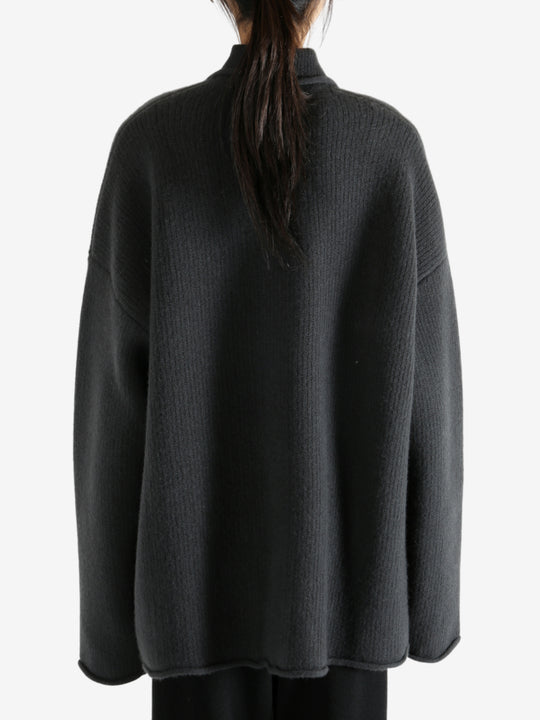 Grey jacket worn by a person, showing the jacket's fit