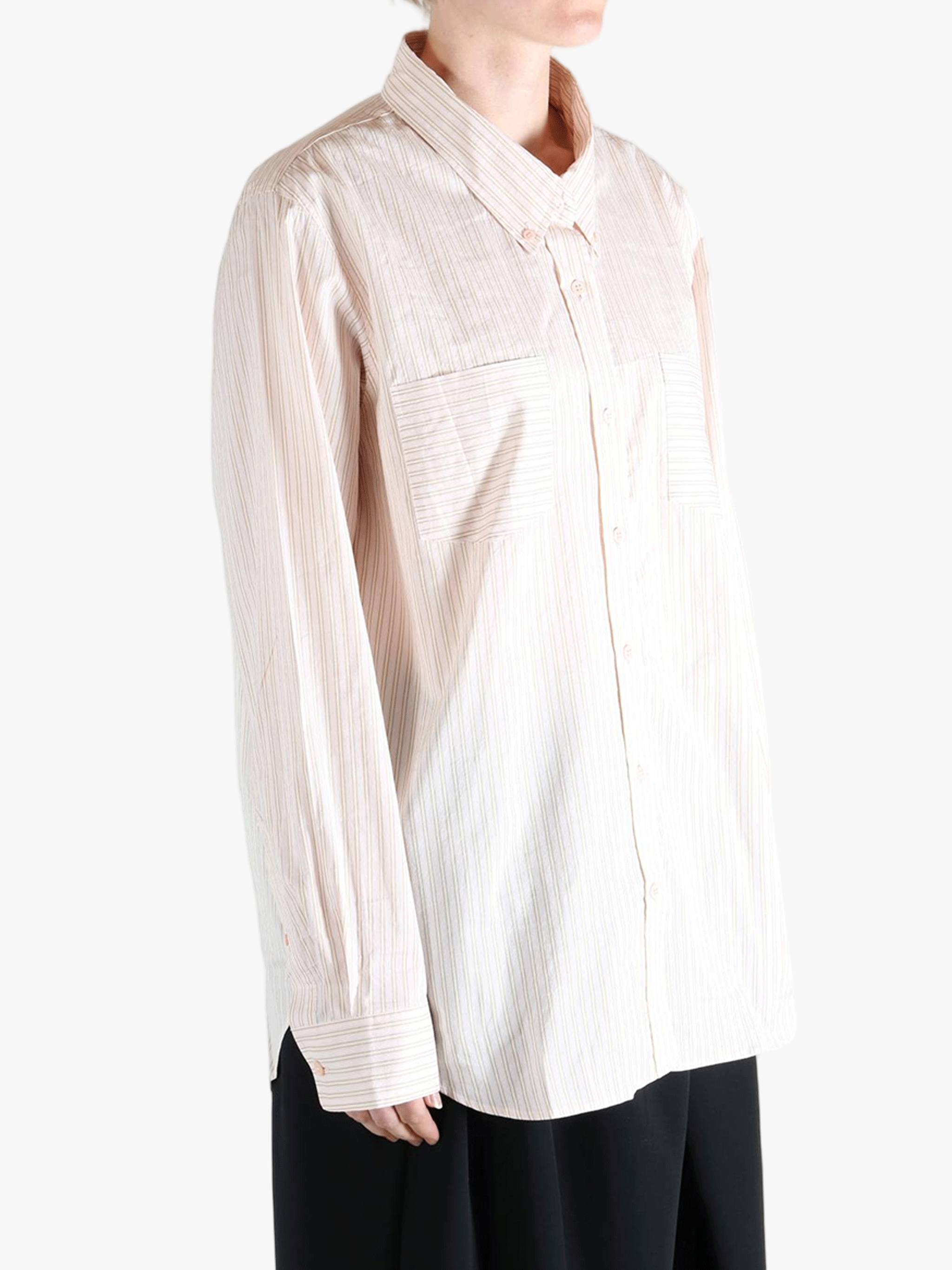 Tan shirts worn by a person, showing the shirt's fit