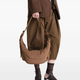 Brown bag worn by a person, showing the bag's fit