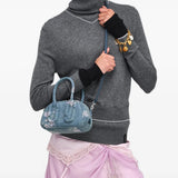 Blue bag worn by a person, showing the bag fit