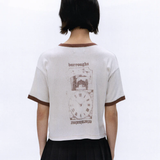 White t-shirt worn by a person, showing the t-shirt's fit