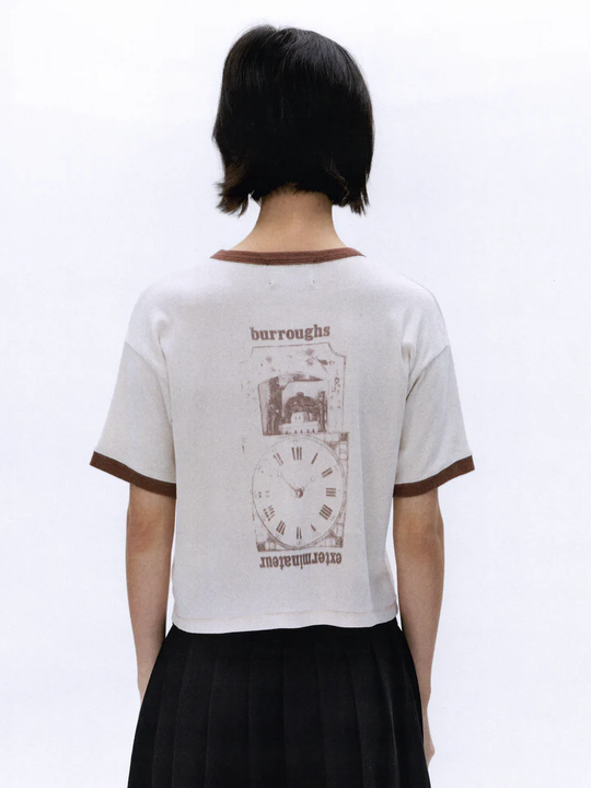 White t-shirt worn by a person, showing the t-shirt's fit