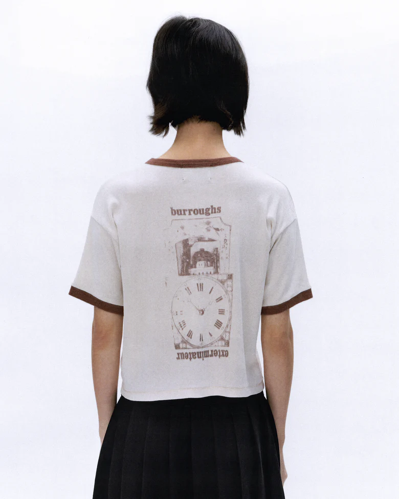 White t-shirt worn by a person, showing the t-shirt's fit