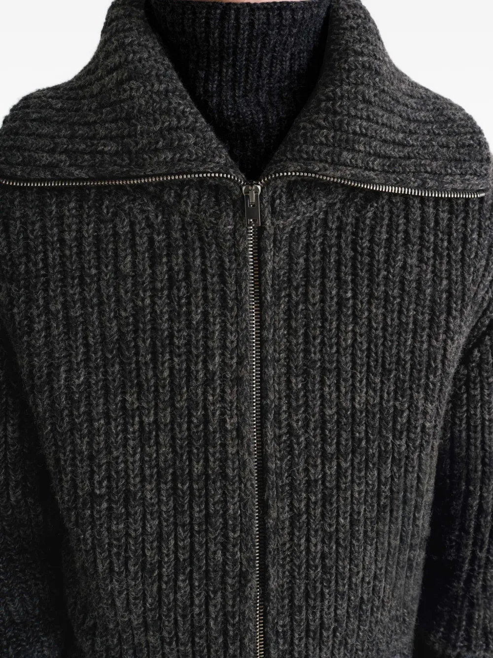 Close up of black cardigan,○showing texture of the alpaca fabric.