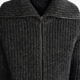 Close up of black cardigan,○showing texture of the alpaca fabric.