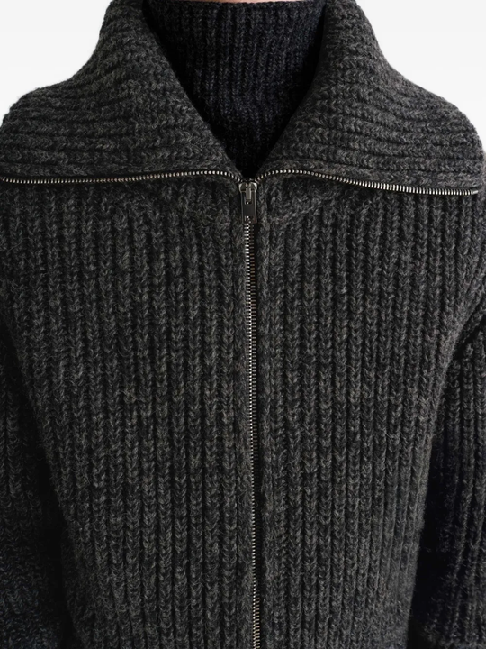 Close up of black cardigan,○showing texture of the alpaca fabric.