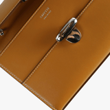 Close up of brown bags, showing texture of the calfskin fabric