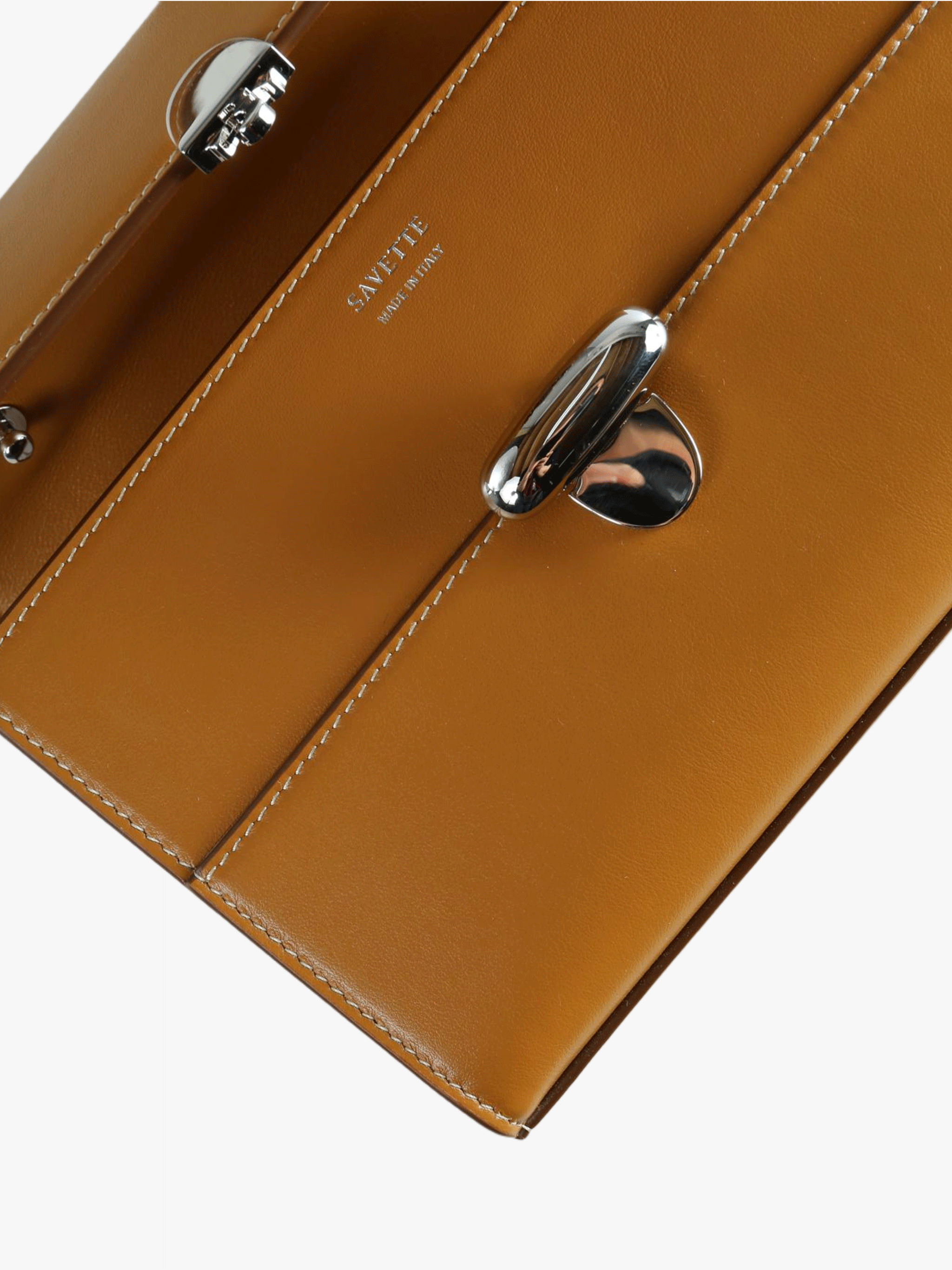 Close up of brown bags, showing texture of the calfskin fabric