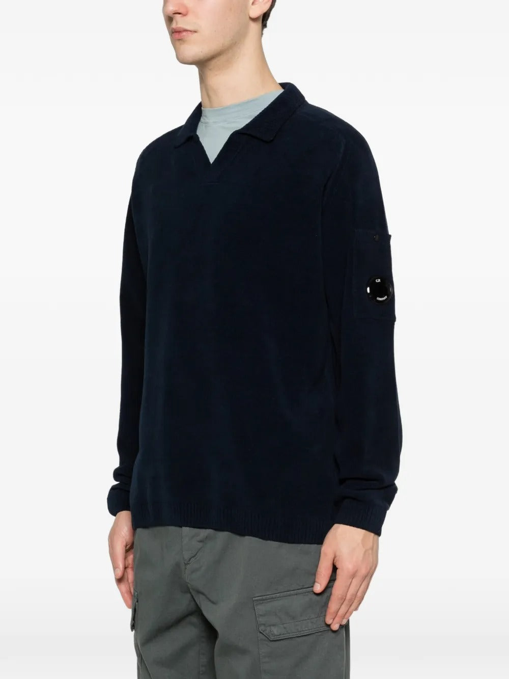 Blue sweater worn by a person, showing the sweater fit