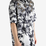 Black shirt worn by a person, showing the shirt's fit