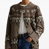 Brown knitwear worn by a person, showing the knitwear's fit