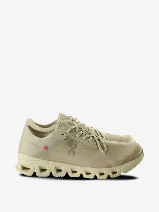Tan sneakers, front view