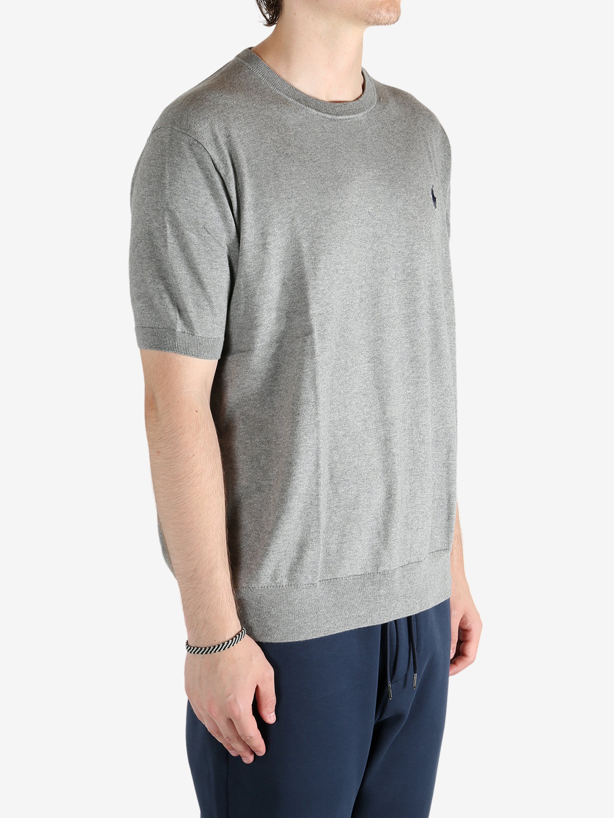 Grey sweater worn by a person, showing the sweater fit