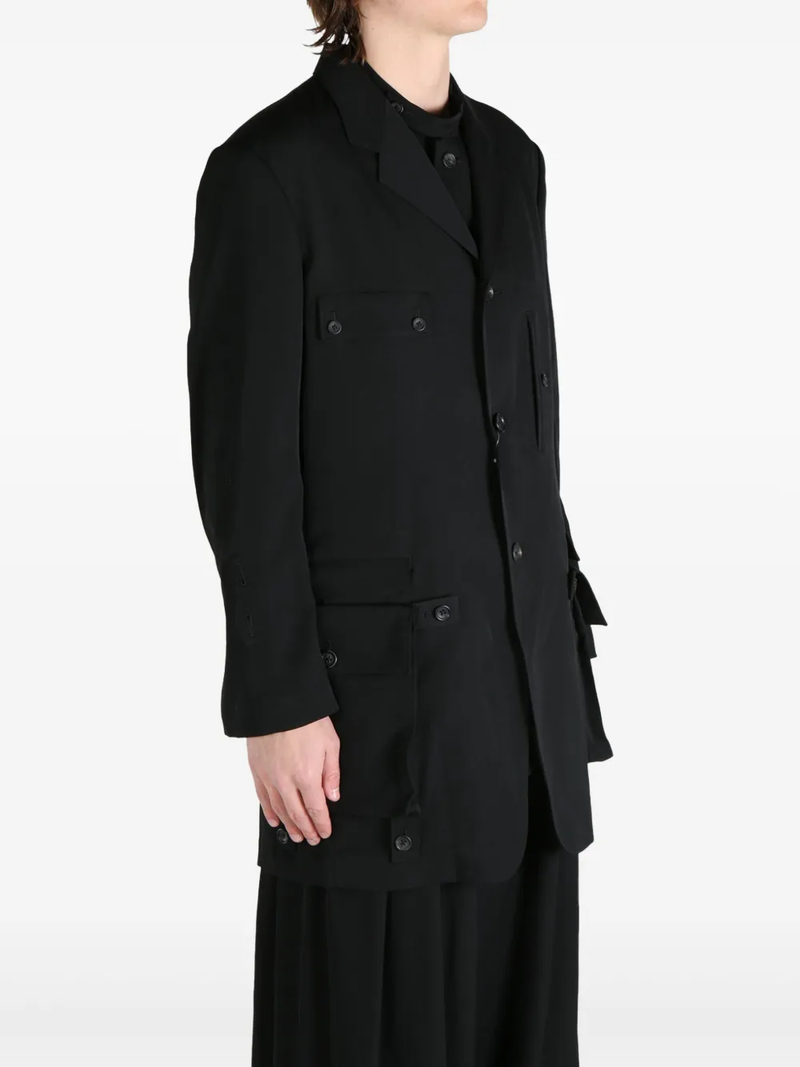 Detachable Pocket Black Blazer, side view worn by a person showing the blazer's fit