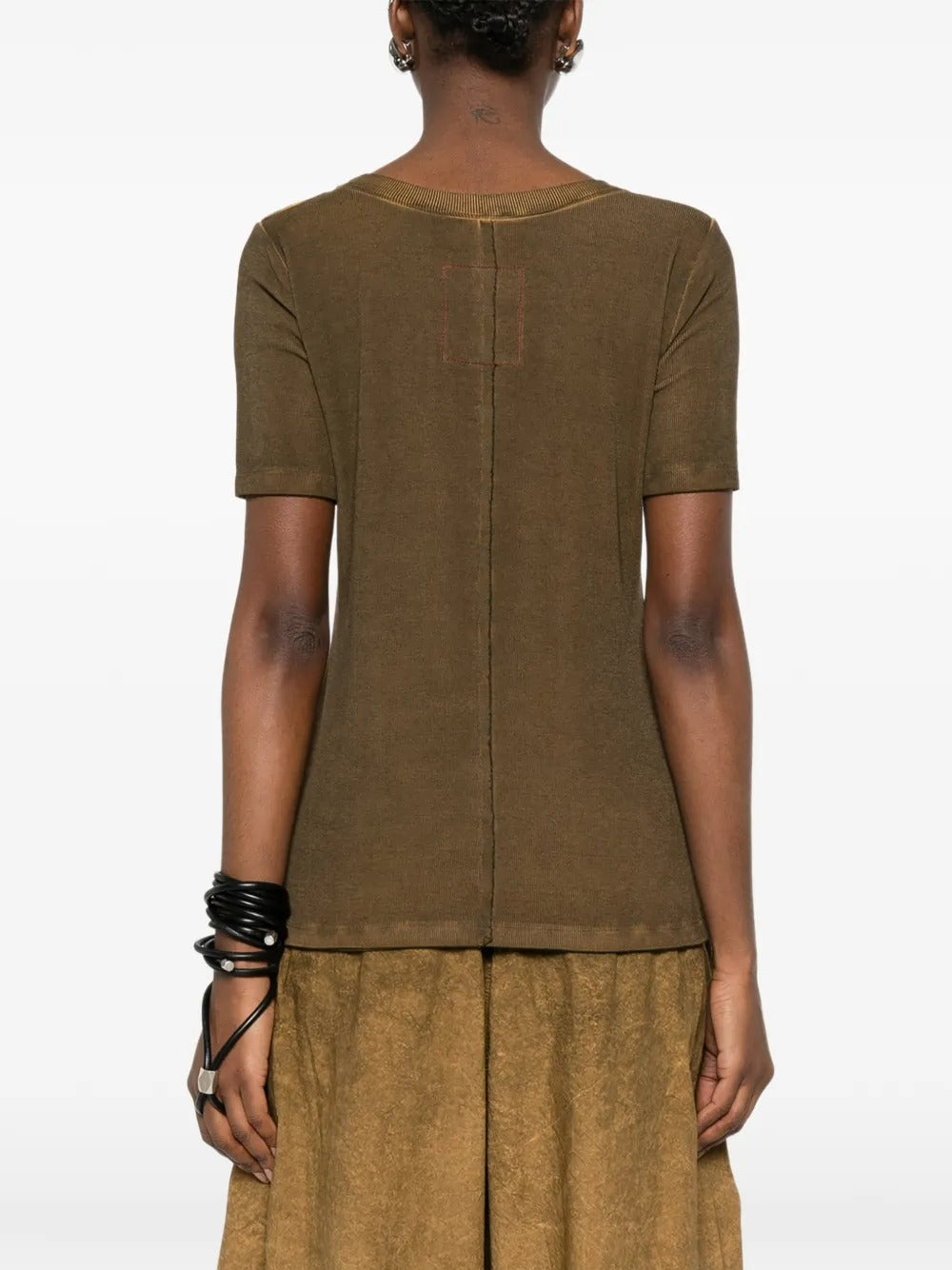 Brown tops worn by a person, showing the tops fit