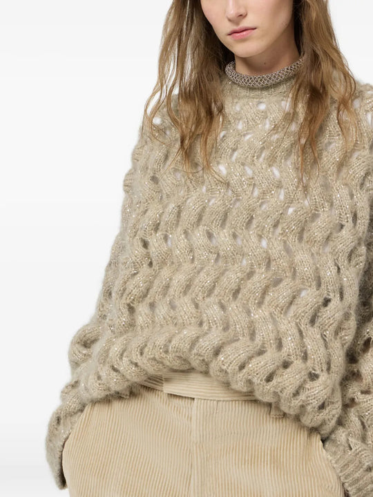 Tan knitwear worn by a person, showing the knitwear fit
