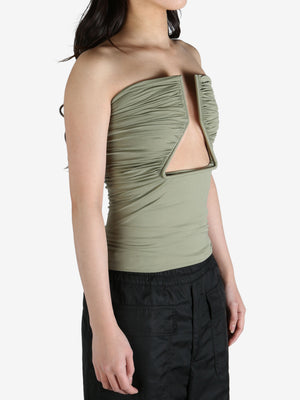 Green top worn by a person, showing the top's fit