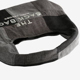 Close up of blalck bag,showing texture of the cotton fabric.