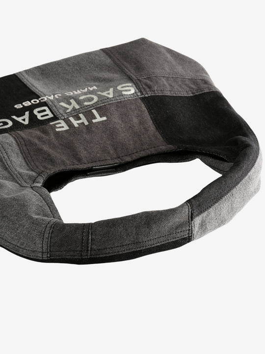 Close up of blalck bag,showing texture of the cotton fabric.