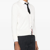 Whtie knitwear worn by a person, showing the cotton fit