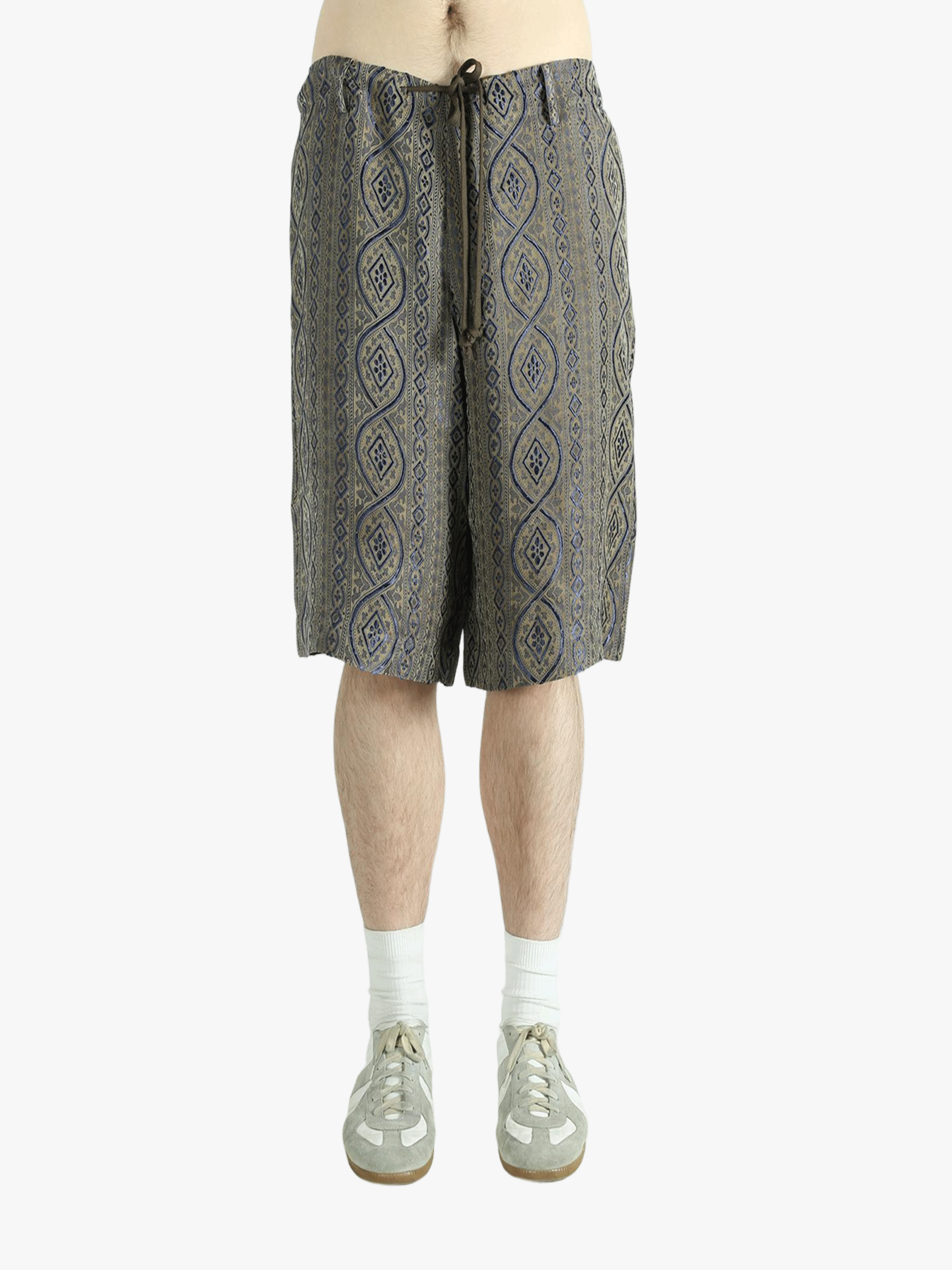 Blue pants worn by a person, showing the pants' fit