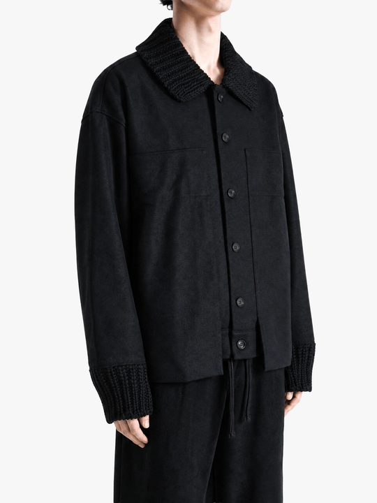 Black jacket worn by a person, showing the jacket fit