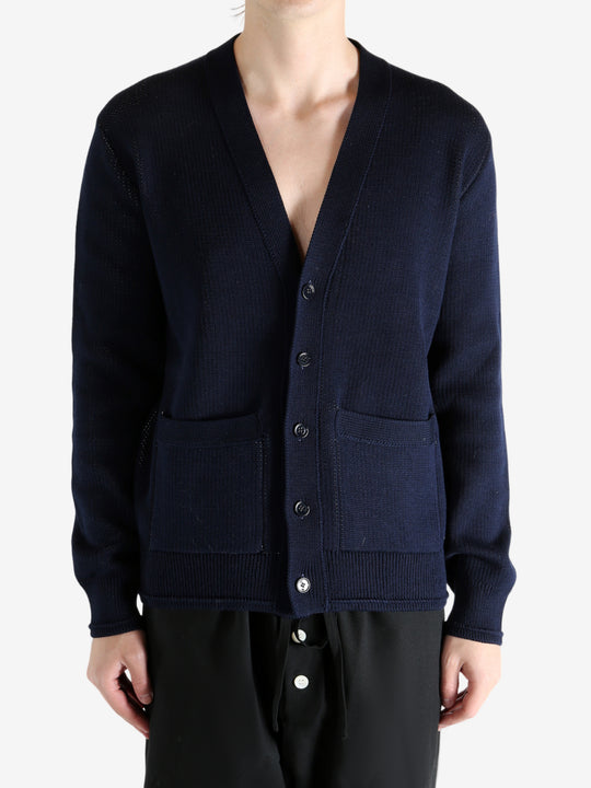 Navy cardigan worn by a person, showing the cardigan's fit
