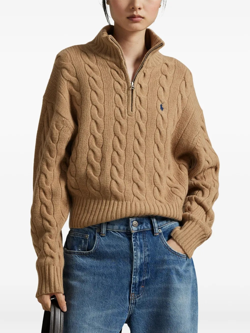 Brown knitwear worn by a person, showing the knitwear's fit