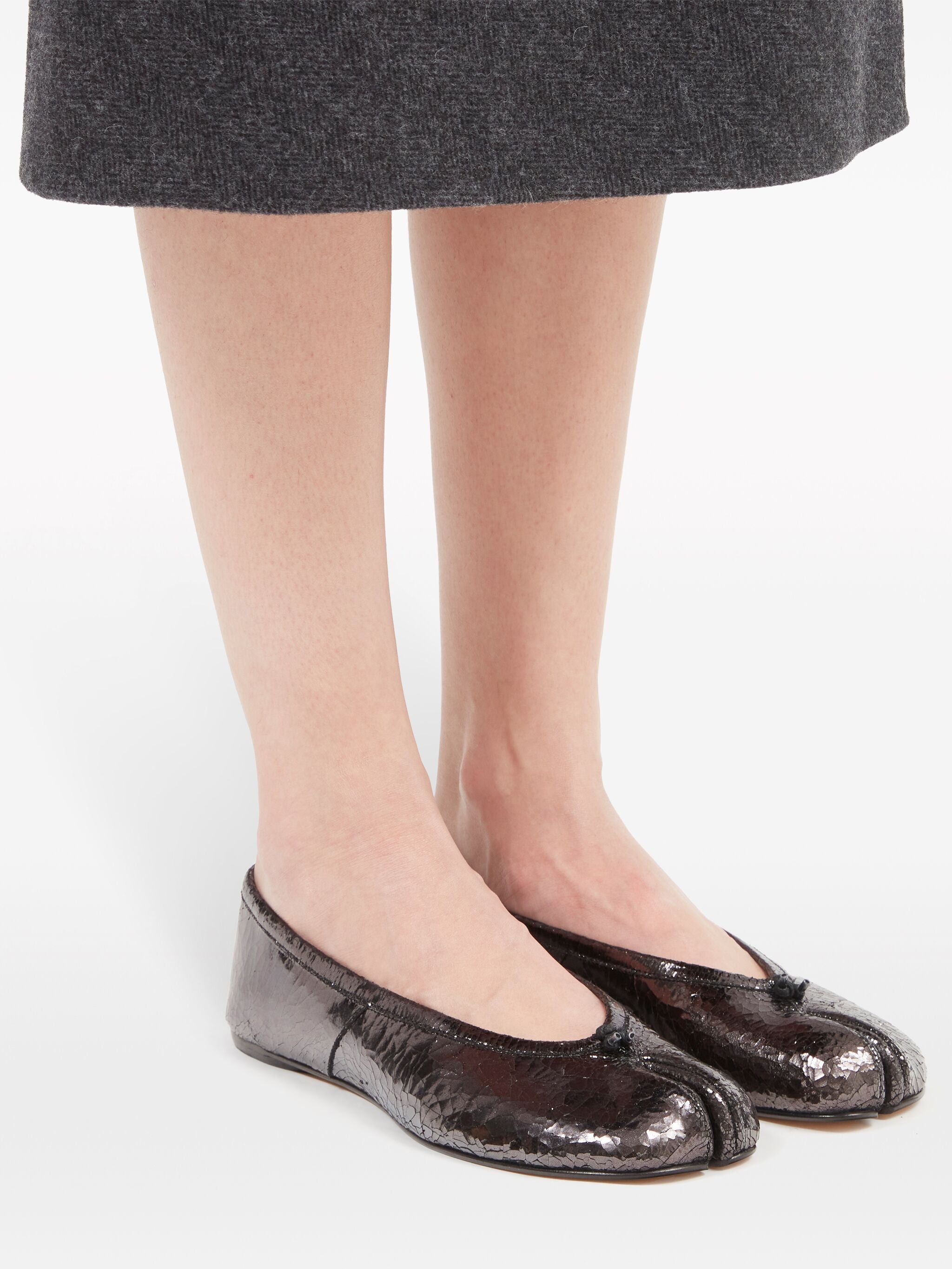 Black flats worn by a person, showing the flats fit