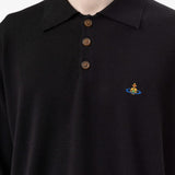 Black top worn by a person, showing the top fit