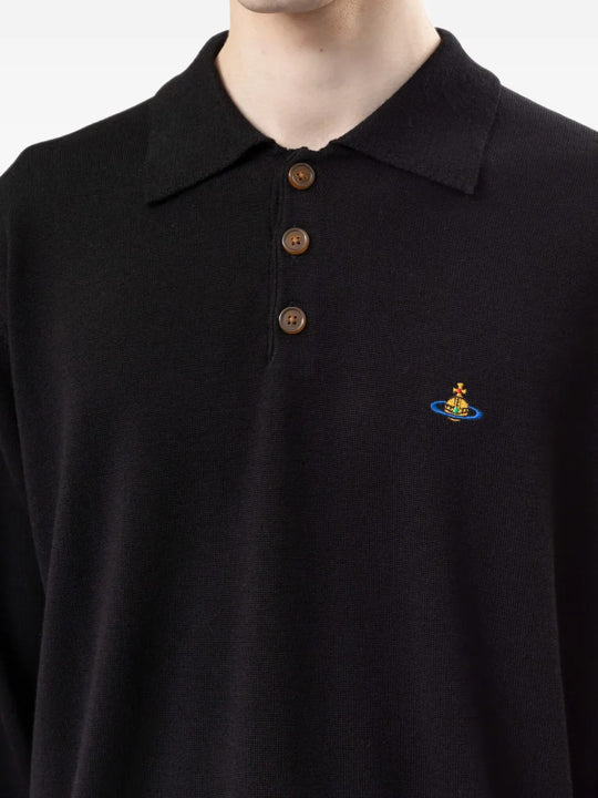 Black top worn by a person, showing the top fit