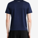 Navy shirt worn by a person, showing the shirt fit