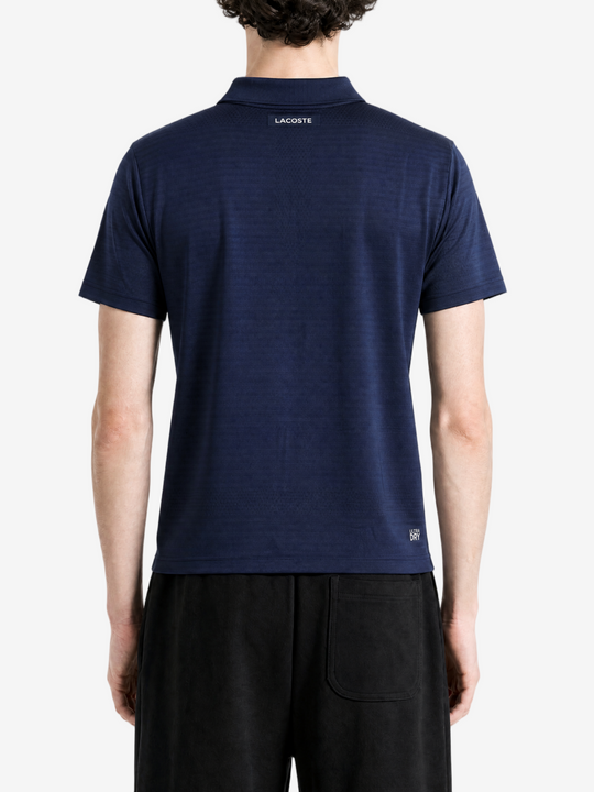 Navy shirt worn by a person, showing the shirt fit