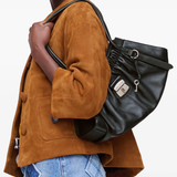 Black bag worn by a person, showing the bag's fit