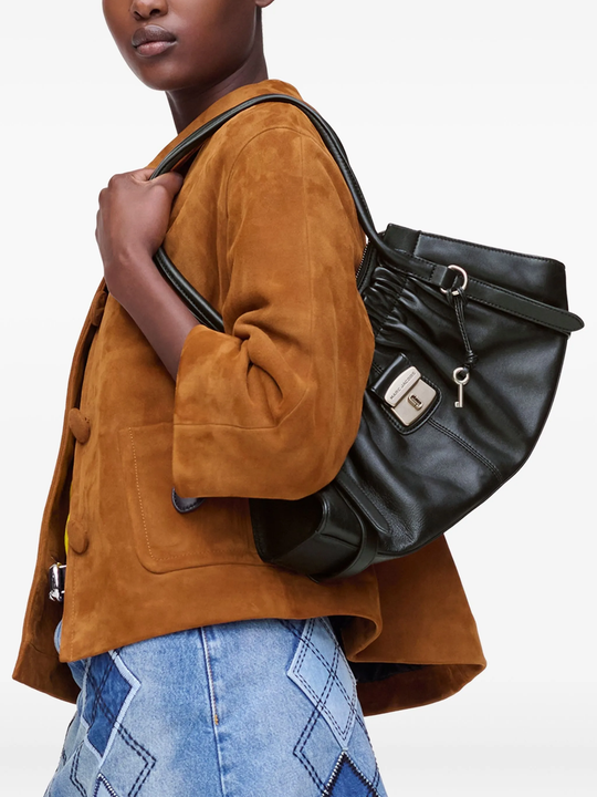 Black bag worn by a person, showing the bag's fit