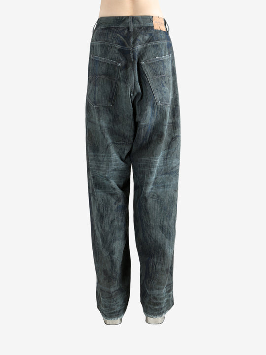 Blue jeans worn by a person, showing the jeans fit