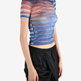 Blue t-shirt worn by a person, showing the shirt's fit